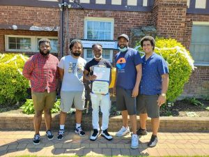 Malique with team leaders after winning ”Student of the Year"